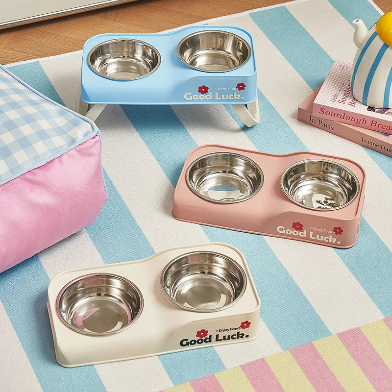 Stainless steel double-bowl elevated pet feeding bowl with non-slip foldable stand suitable for small to medium dogs and cats